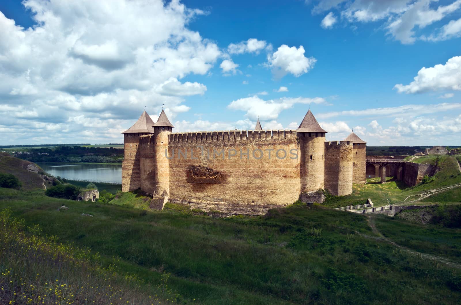 Khotyn castle on Dniester riverside. Dramatic blue sky. Ukraine by dolnikow