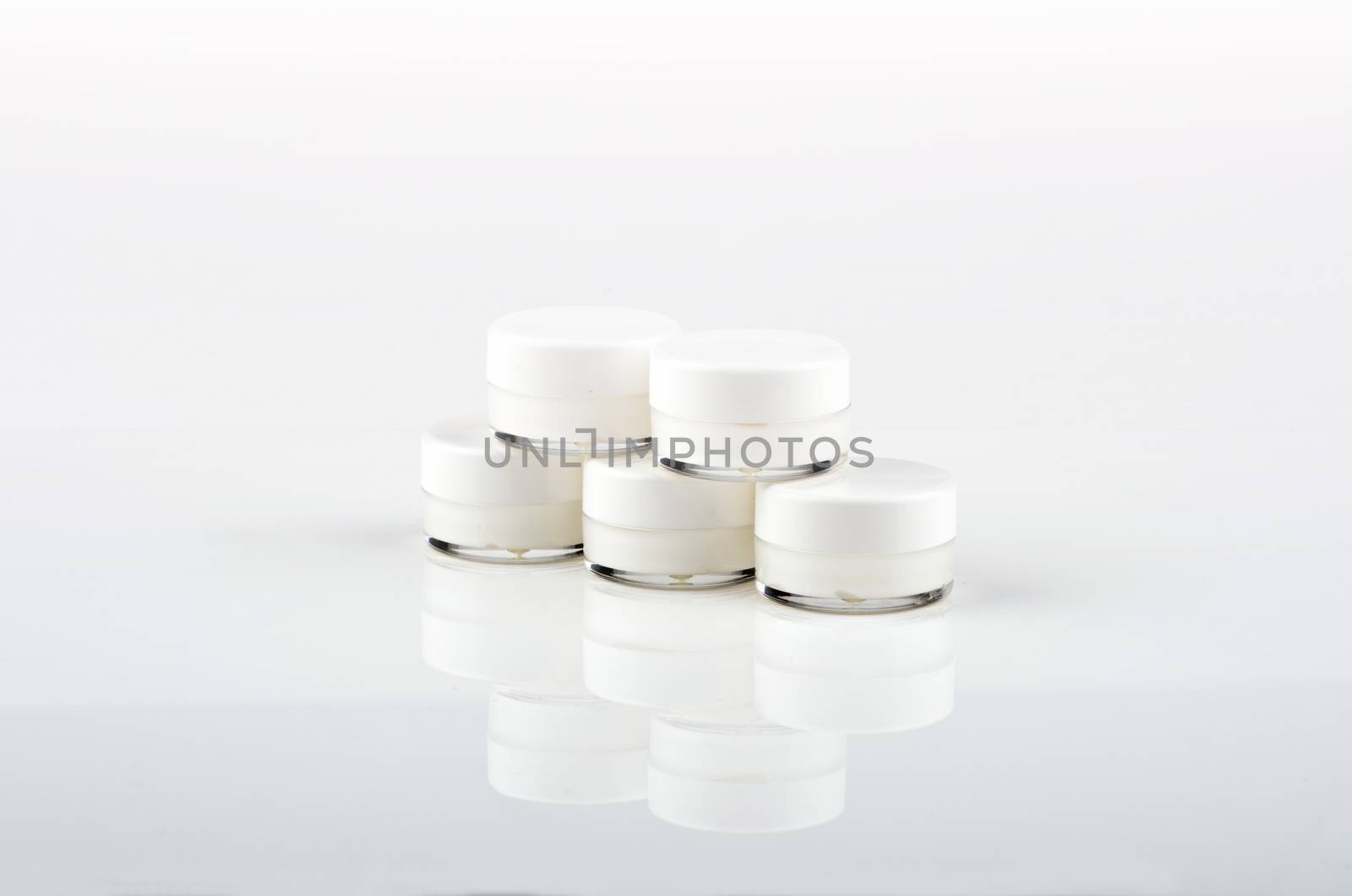 Blank white facial cream jar isolate on white background by dolnikow