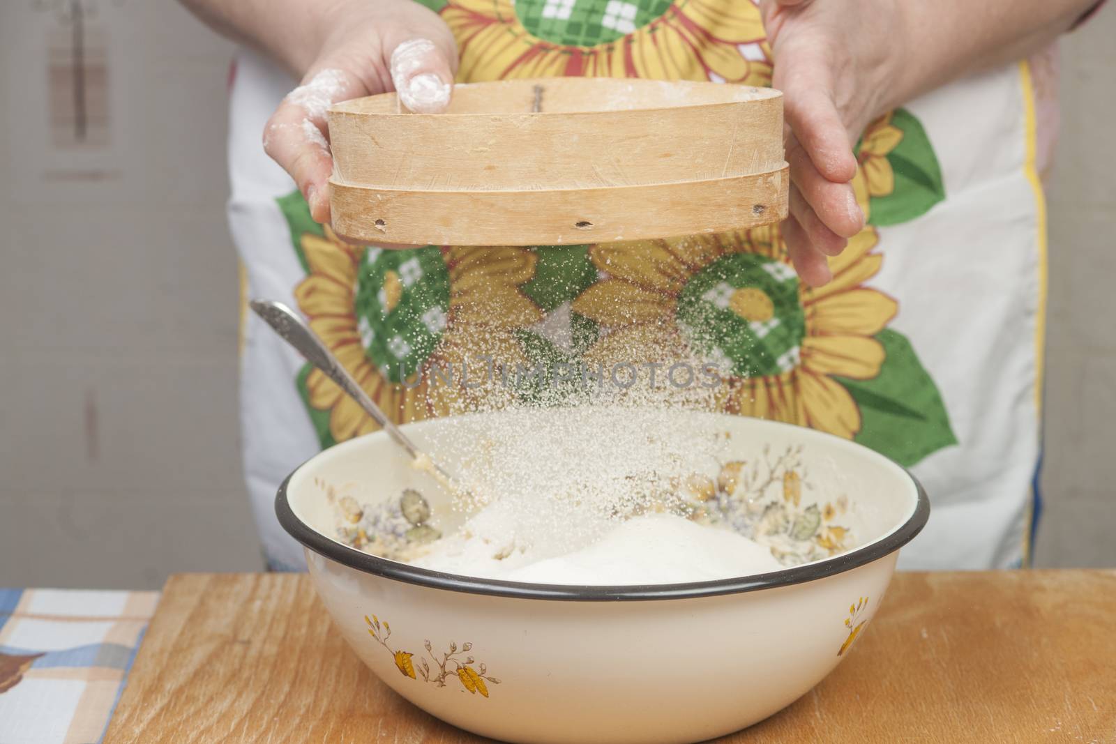 Women's hands preparing flour before baking pie by kozak