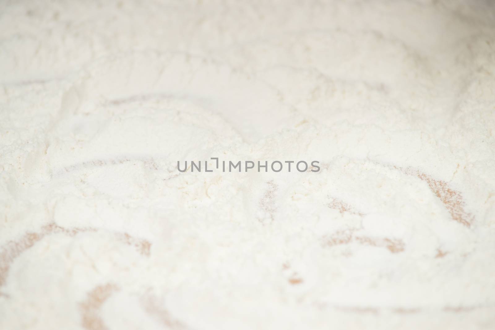 Women's hands preparing flour before baking pie.