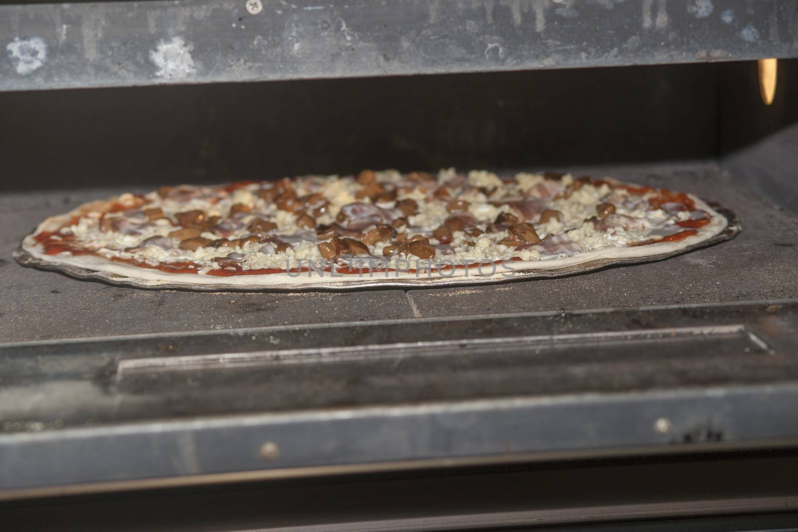 Pizza baking in the oven. High resolution