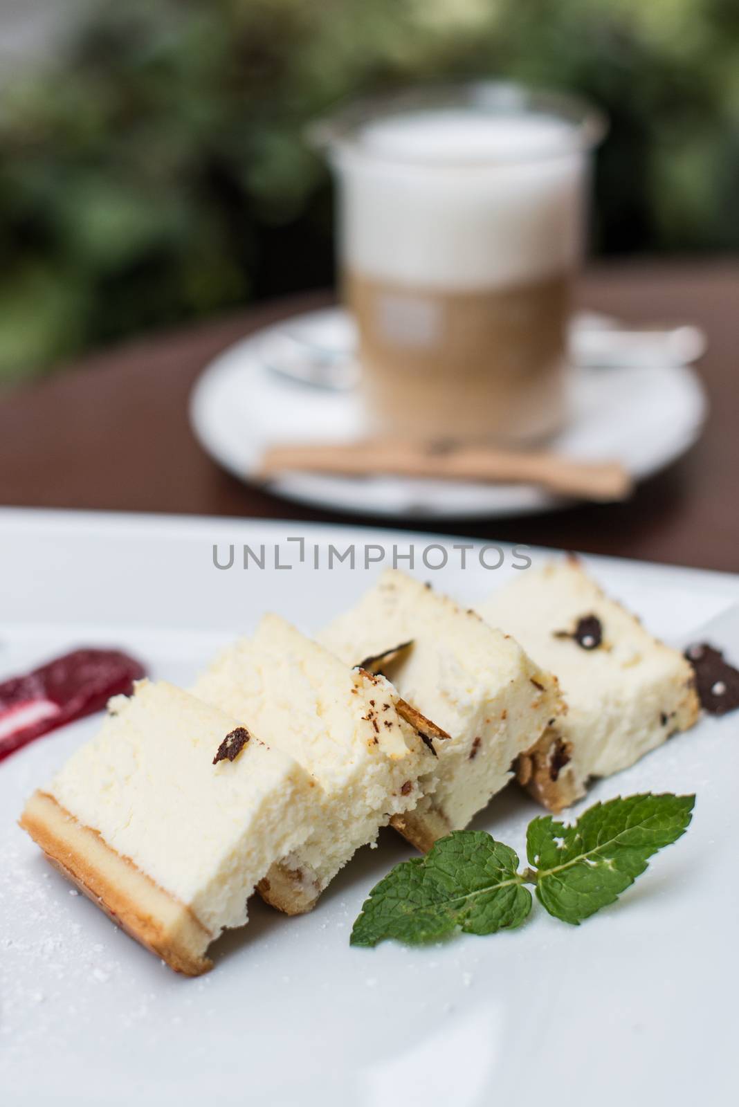 Cheesecake is delicious on a white plate with coffee