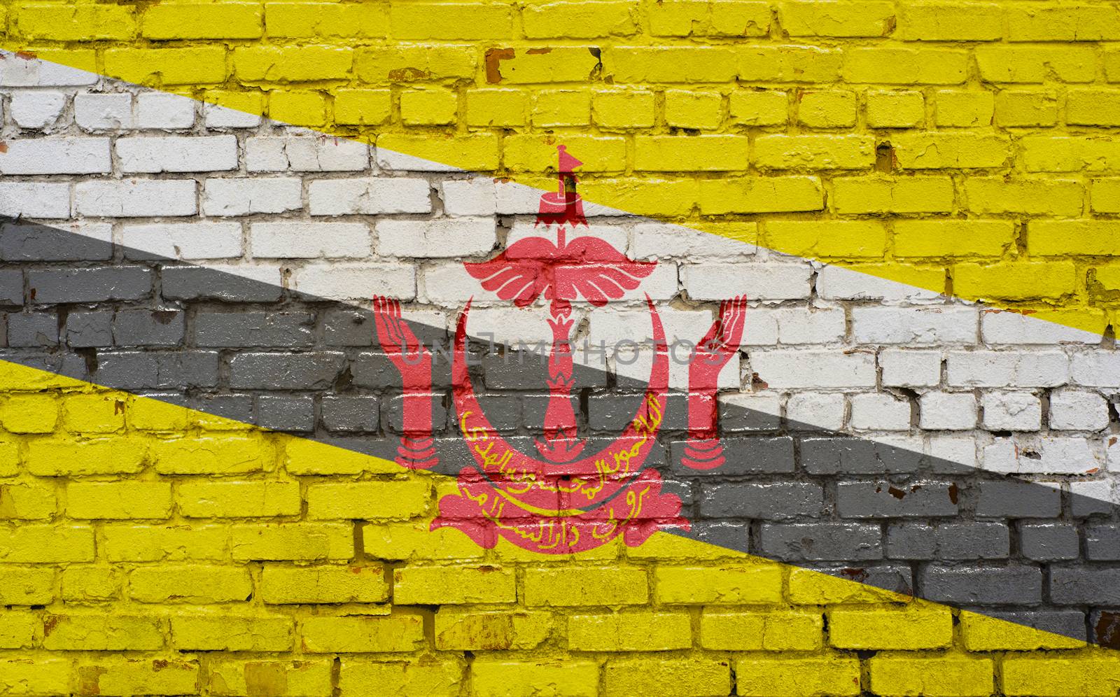 Flag of Brunei painted on brick wall, background texture