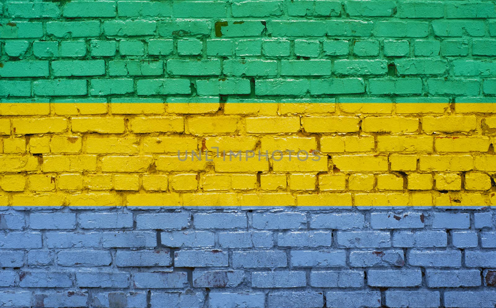Flag of Gabon painted on brick wall, background texture