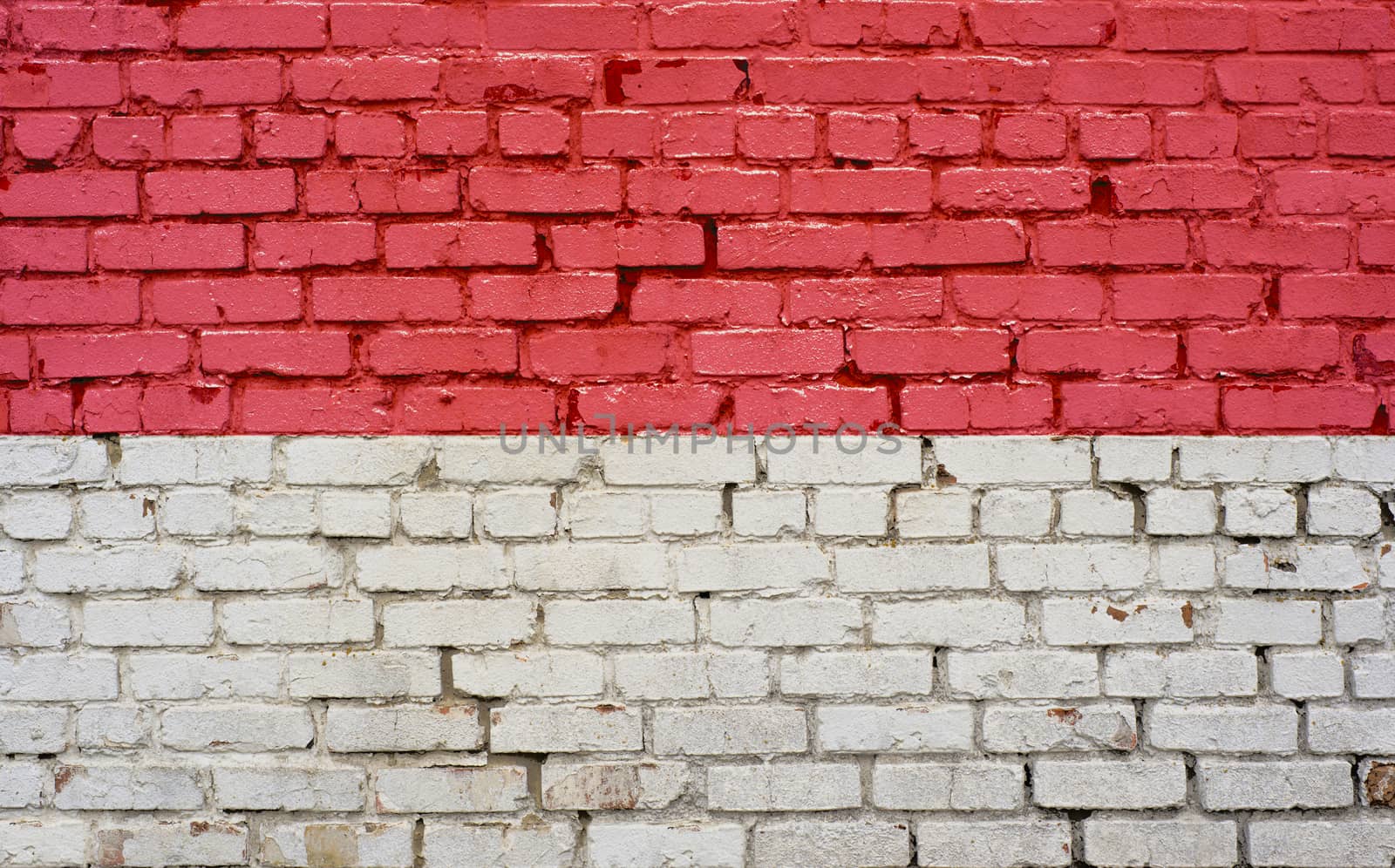 Flag of Monaco painted on brick wall, background texture