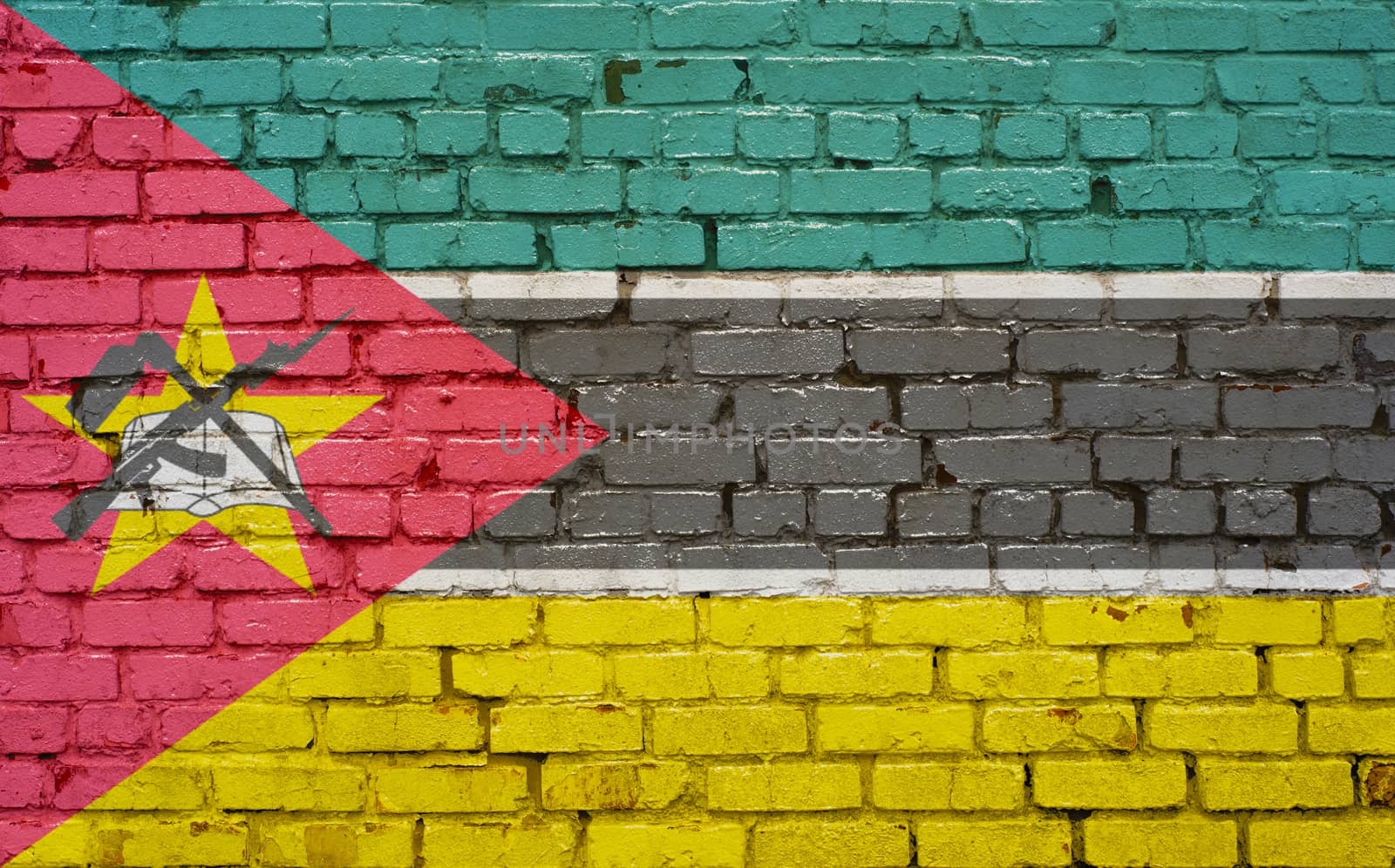 Flag of Mozambique painted on brick wall, background texture