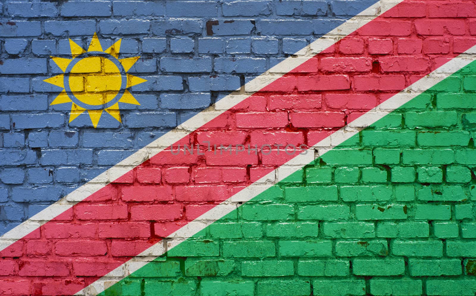 Flag of Namibia painted on brick wall, background texture