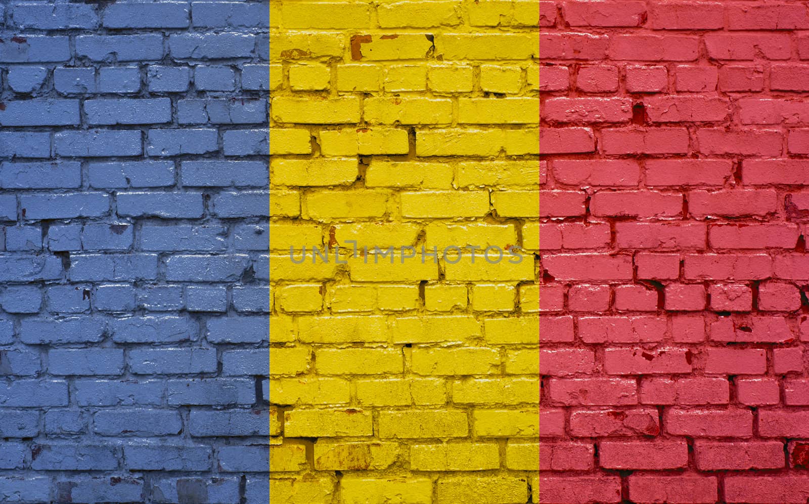 Flag of Romania painted on brick wall, background texture