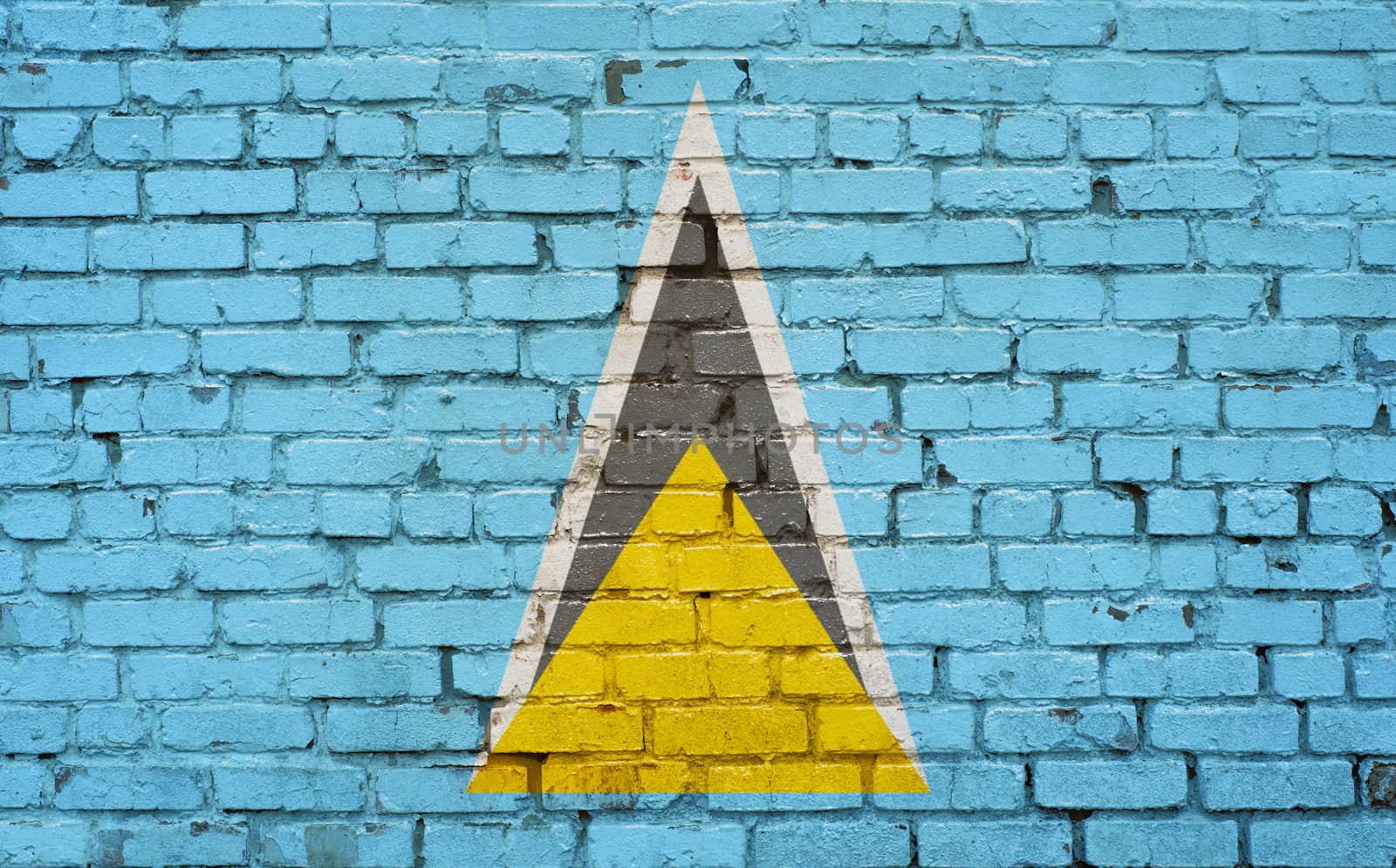 flag of Saint Lucia painted on brick wall