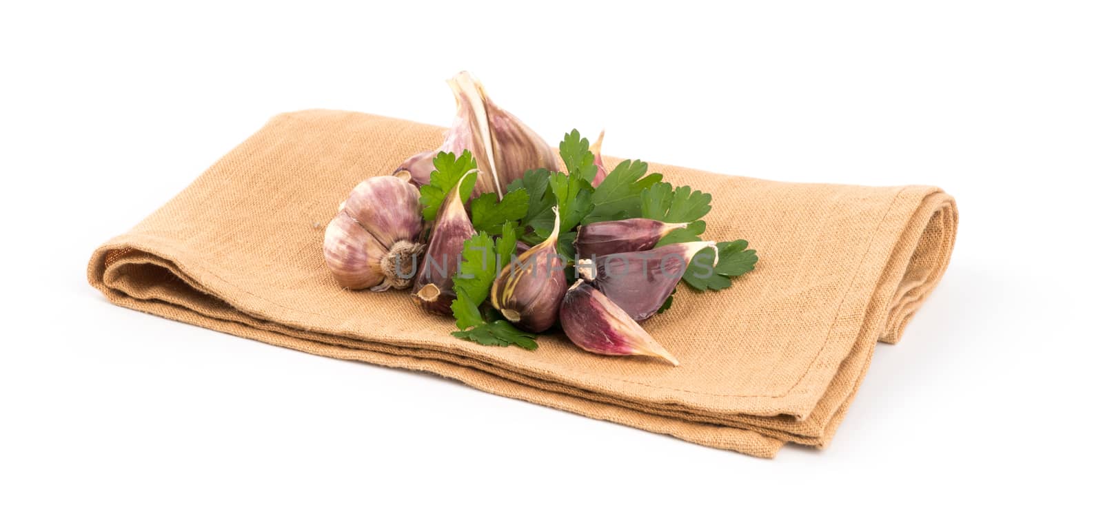 isolated garlic and green parsley on white