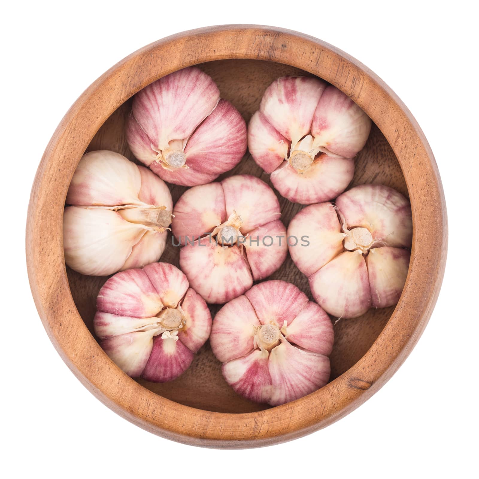 Garlic on wooden bowl top view of white background