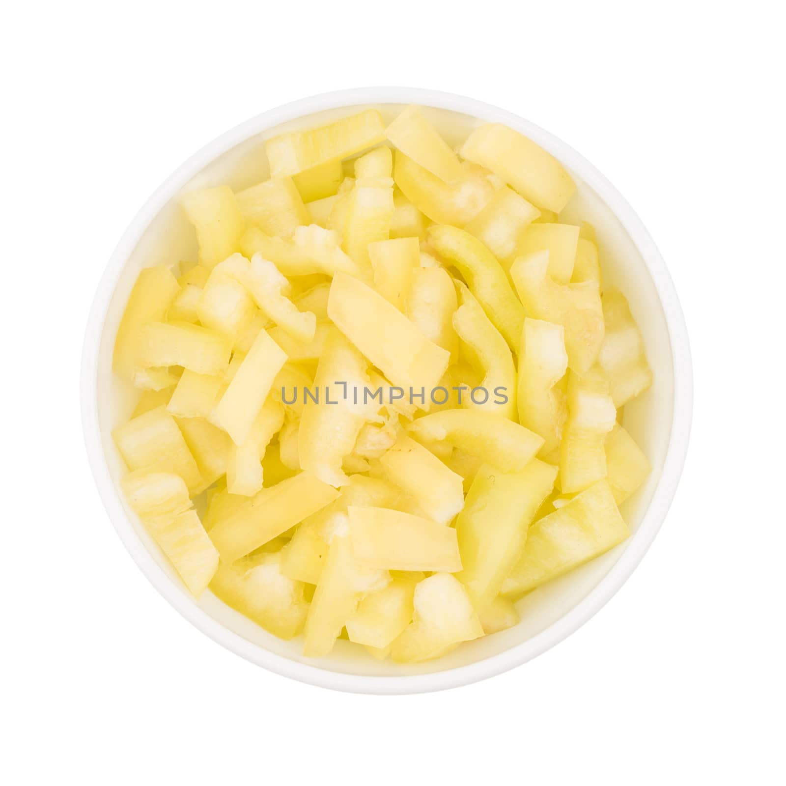 yellow sliced pepper in a white bowl. isolated on white background.