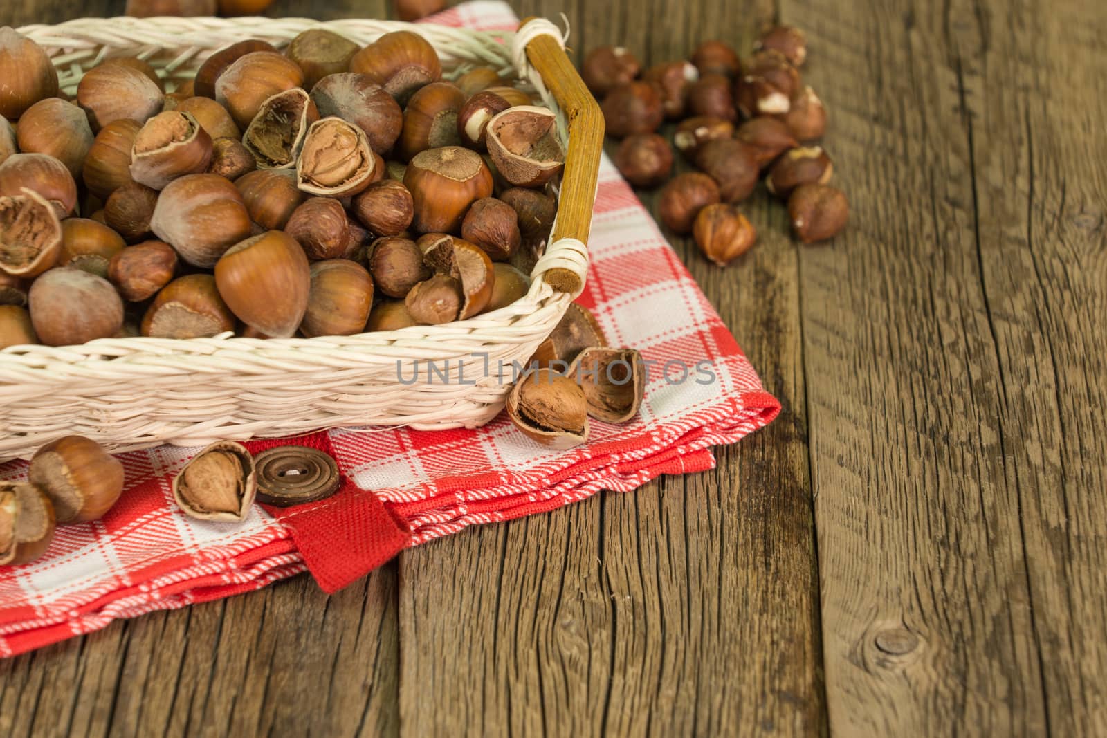 Hazelnuts in small wicker basket by DGolbay