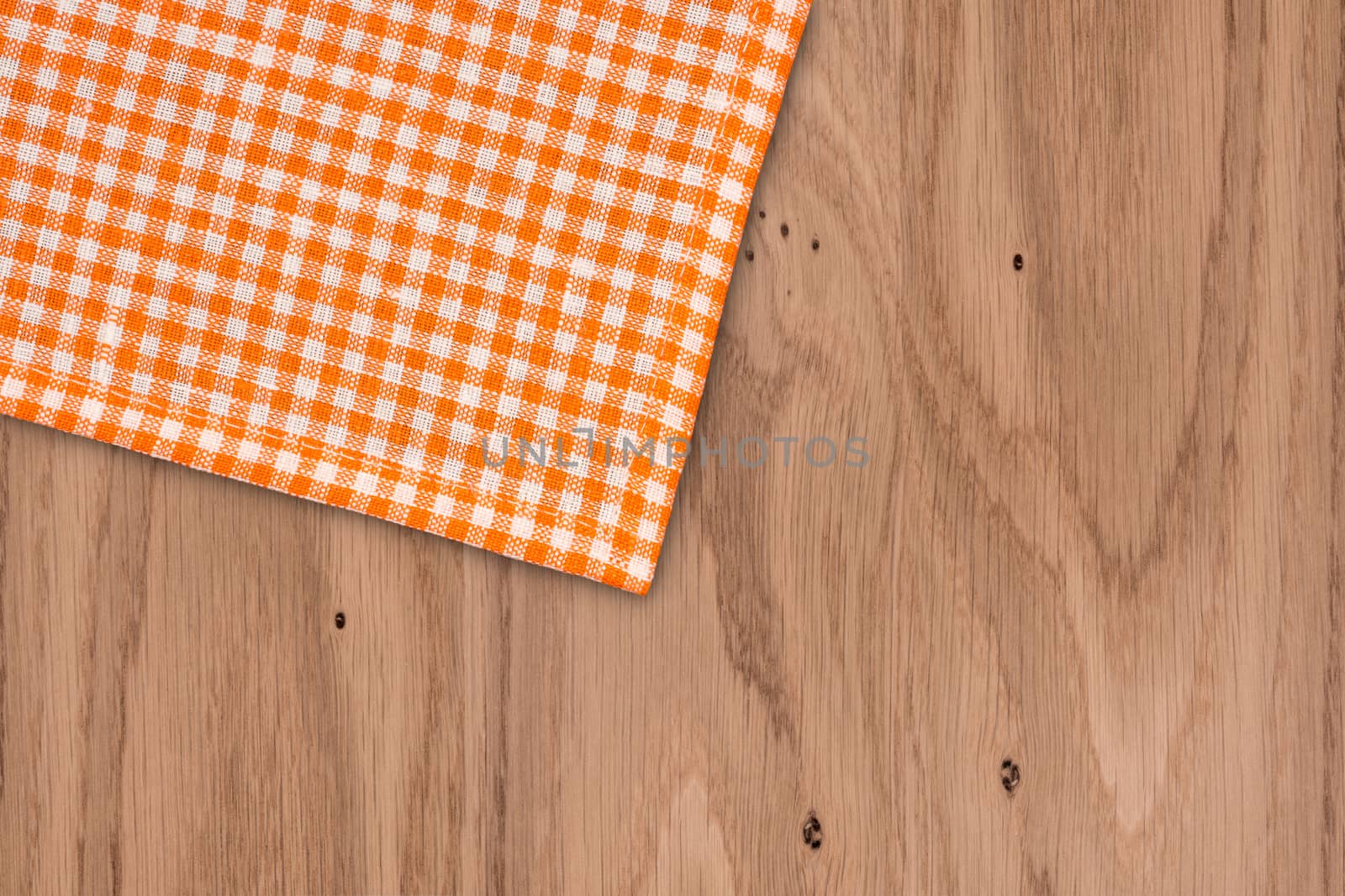 Rustic wooden boards with a orange checkered tablecloth