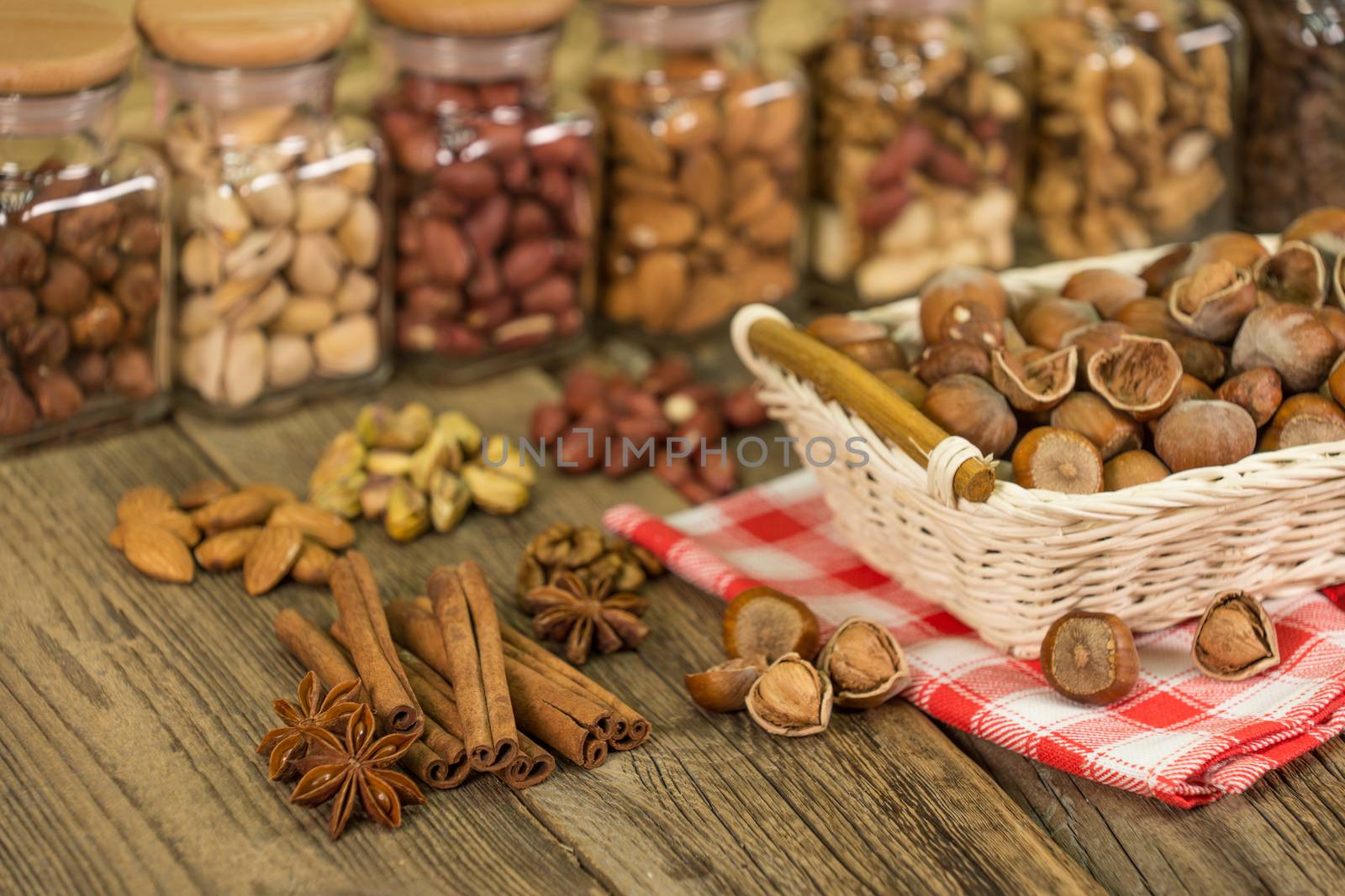 Mix of nuts in the glass jars , on the table, selective focus