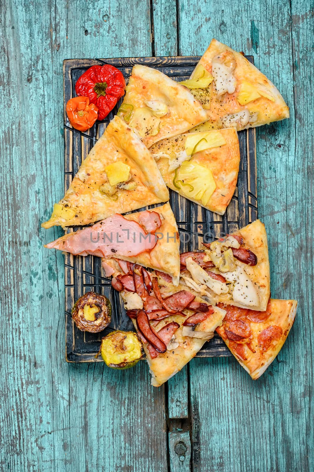 Pizza stuffed with meat and baked vegetables in rustic style