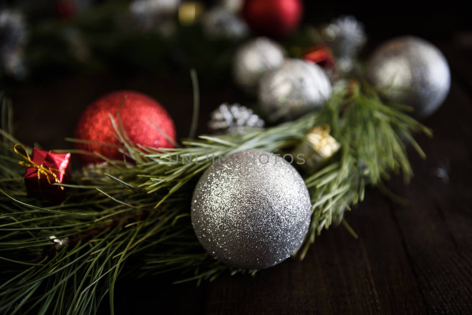 Christmas wreath of fir branches with Christmas decorations by Andreua