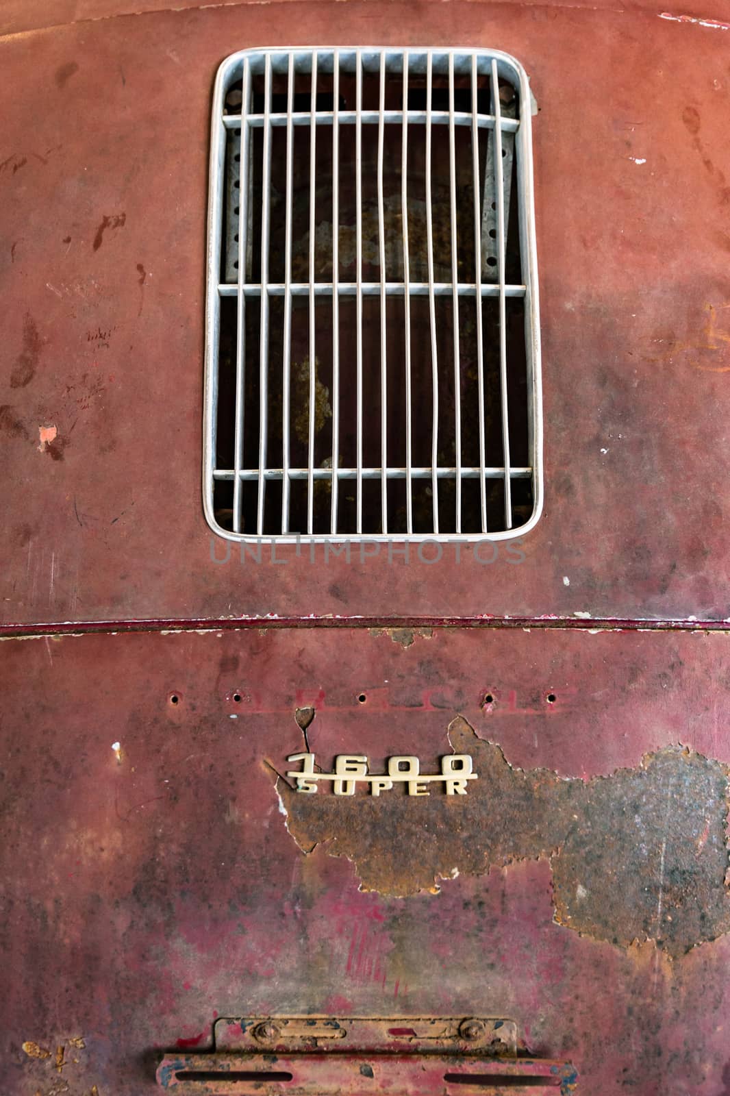 Detail of old Italian rusty car to be restored. by Isaac74