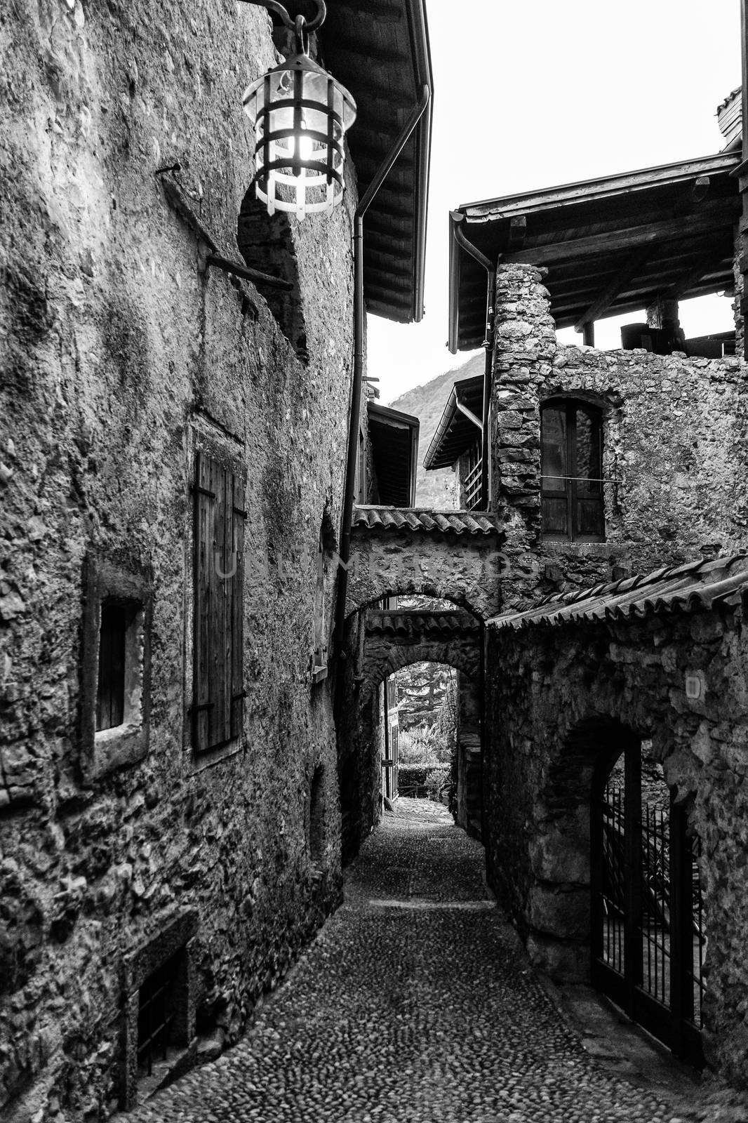 Narrow alley in a medieval village in northern Italy.