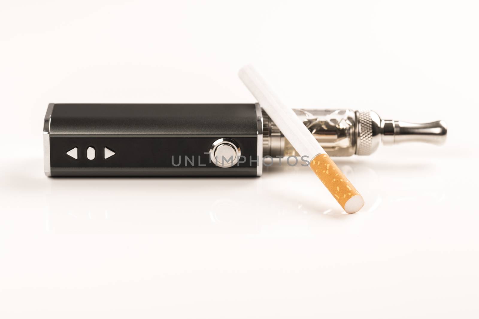 electronic cigarettes and tabacco on white background by CatherineL-Prod