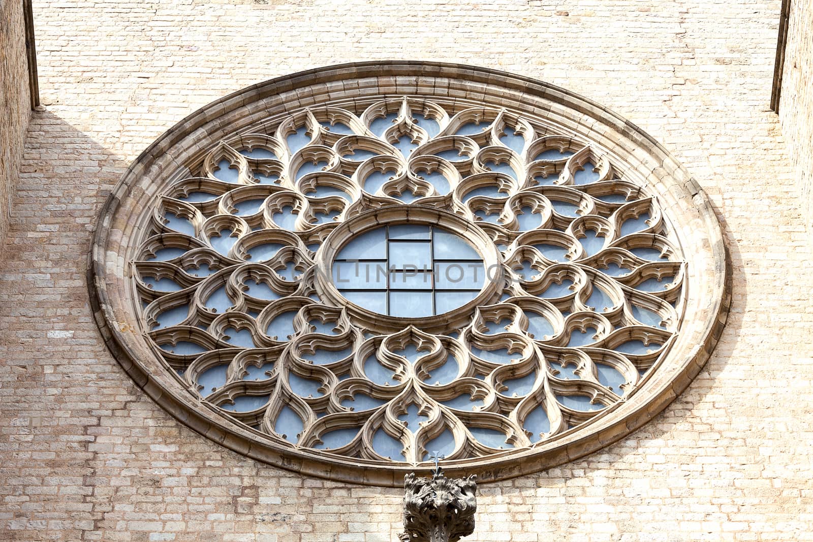 Rose window on facade of gothic church Santa Maria del Mar, Barcelona, Spain