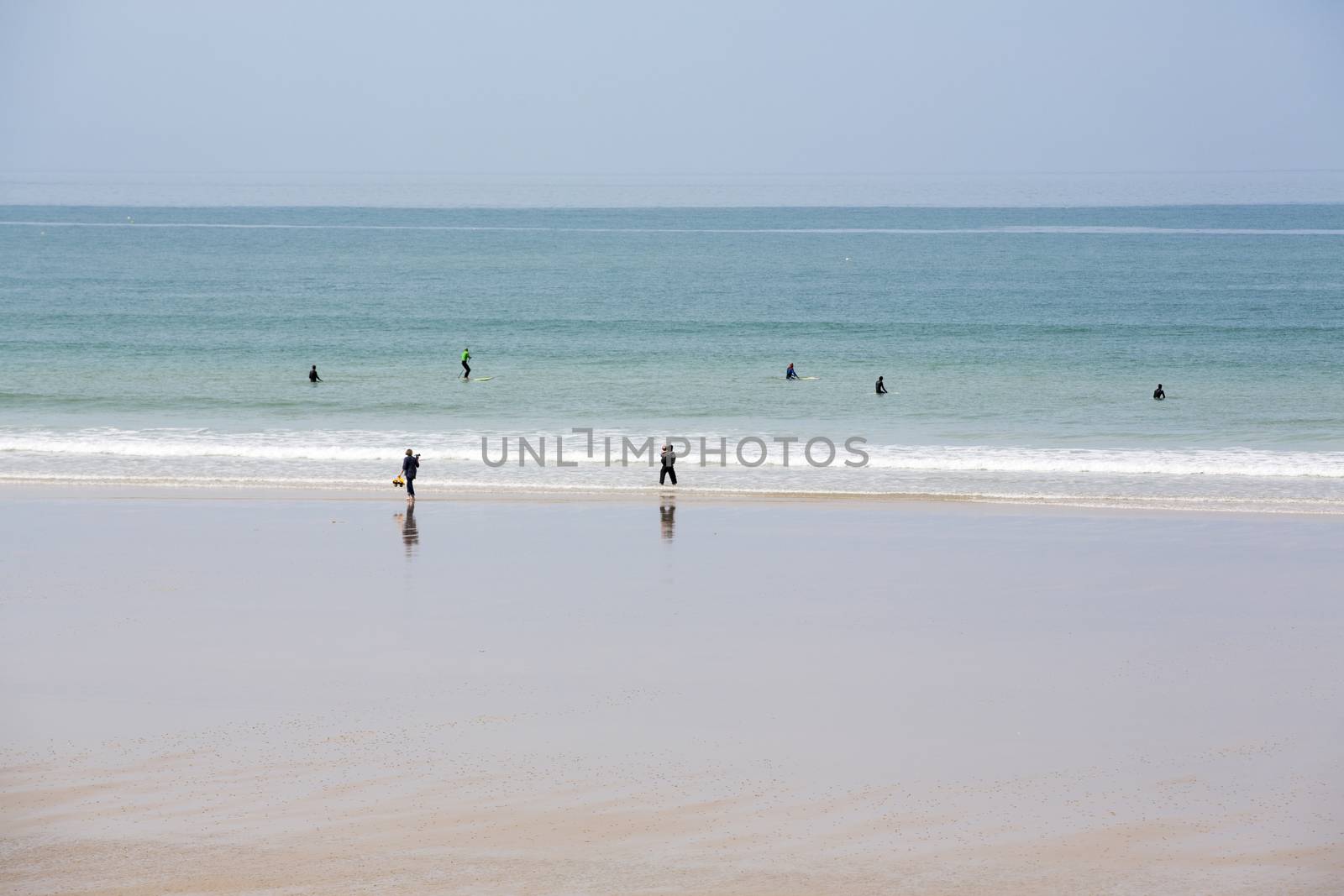 beach coastline sun sand ocean walk people France Normandy Hague