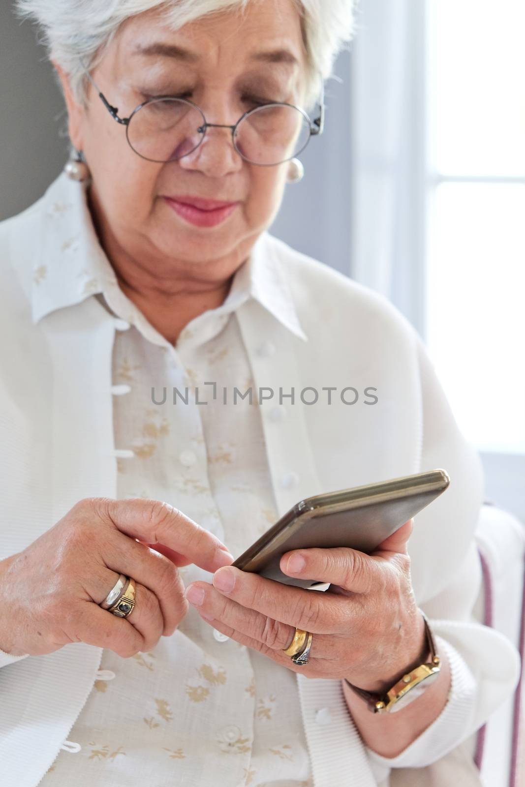 Senior woman using her mobile phone.