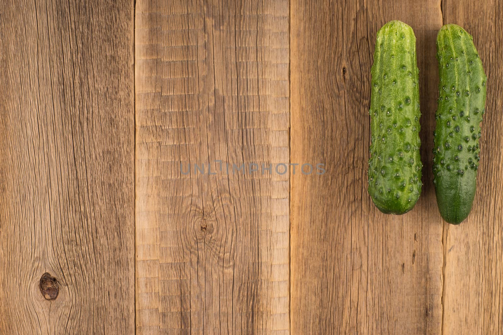 Cucumbers on a wooden background.