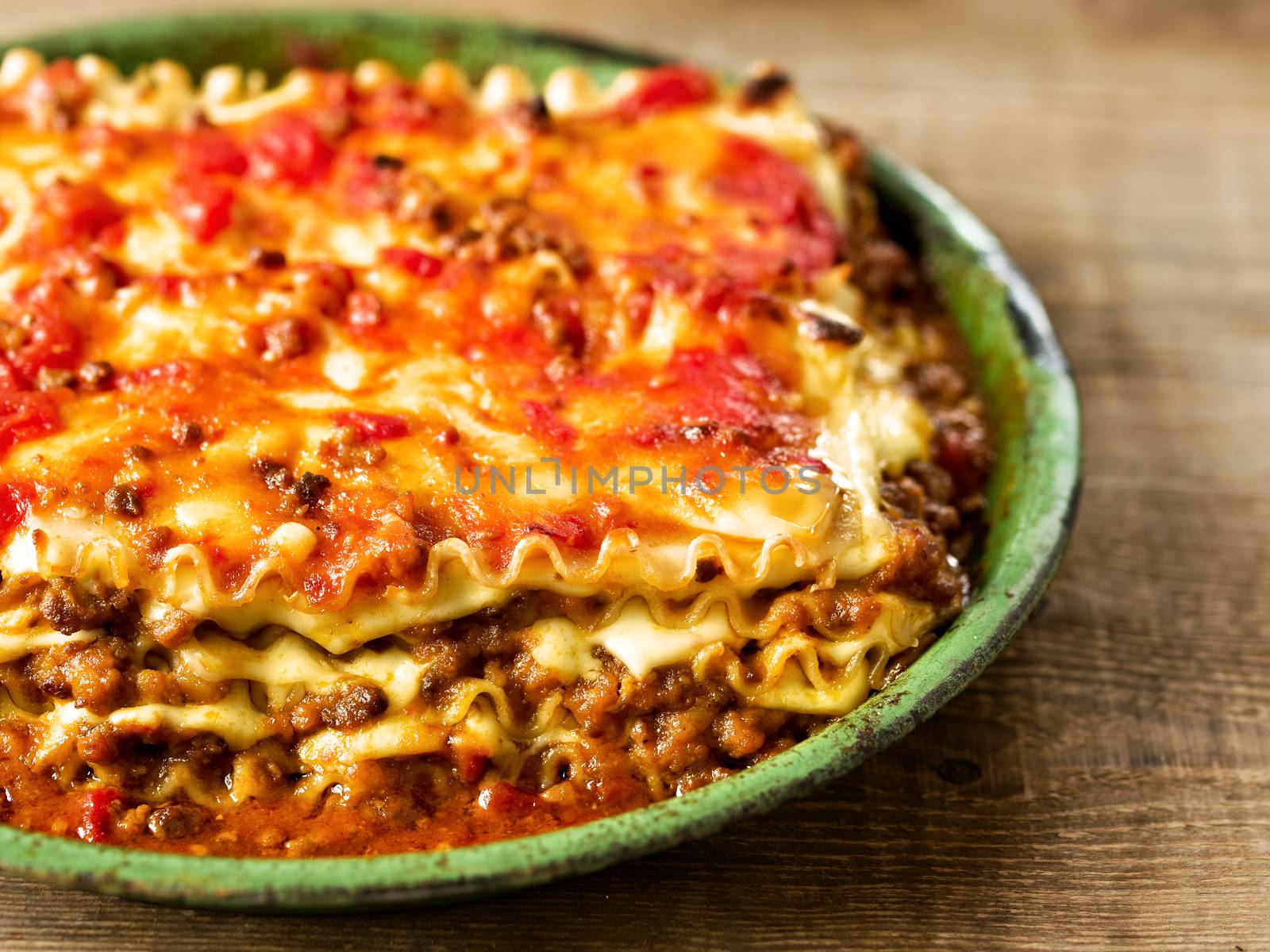 close up of rustic italian cheesy lasagna pasta