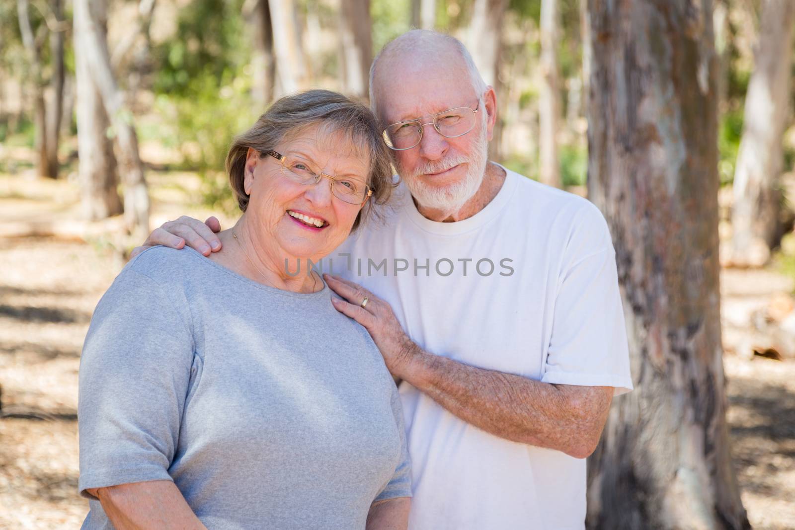 Happy Senior Couple Portrait Outdoors At Park.