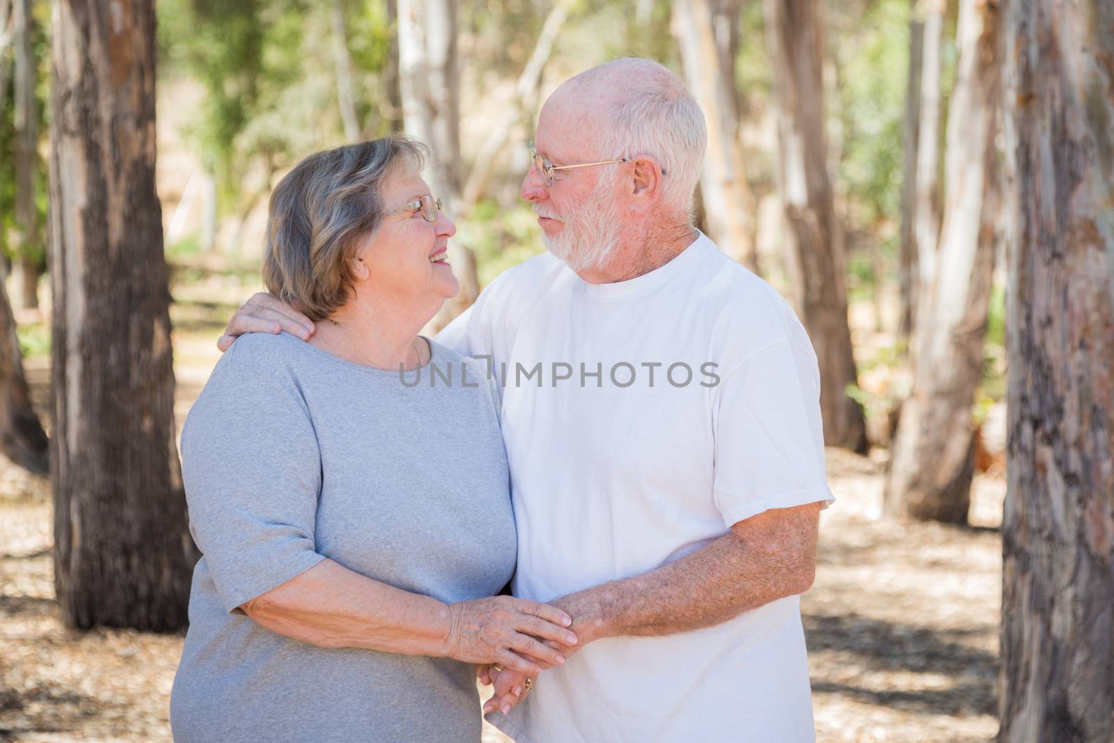 Happy Senior Couple Portrait Outdoors by Feverpitched