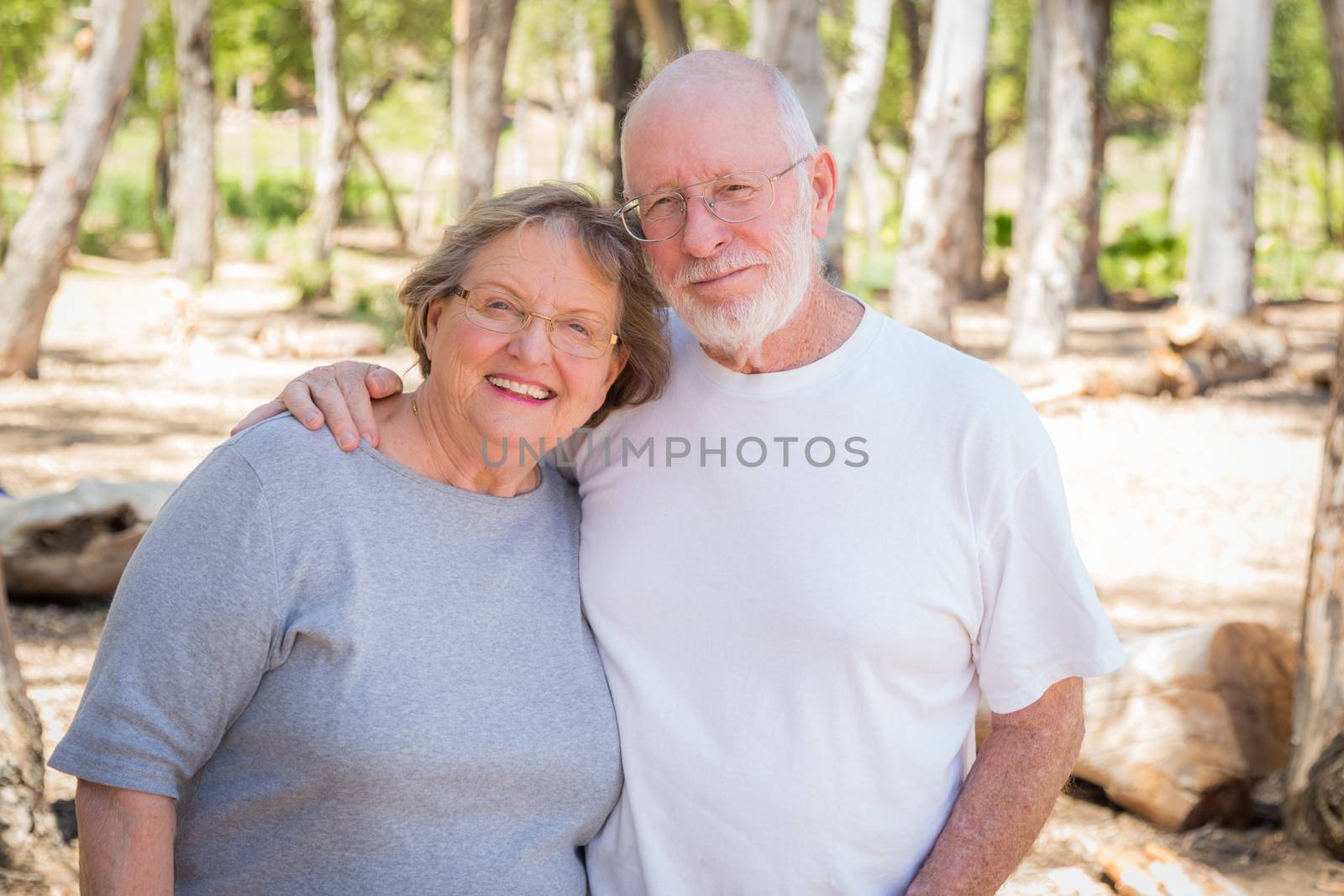 Happy Senior Couple Portrait Outdoors At Park.