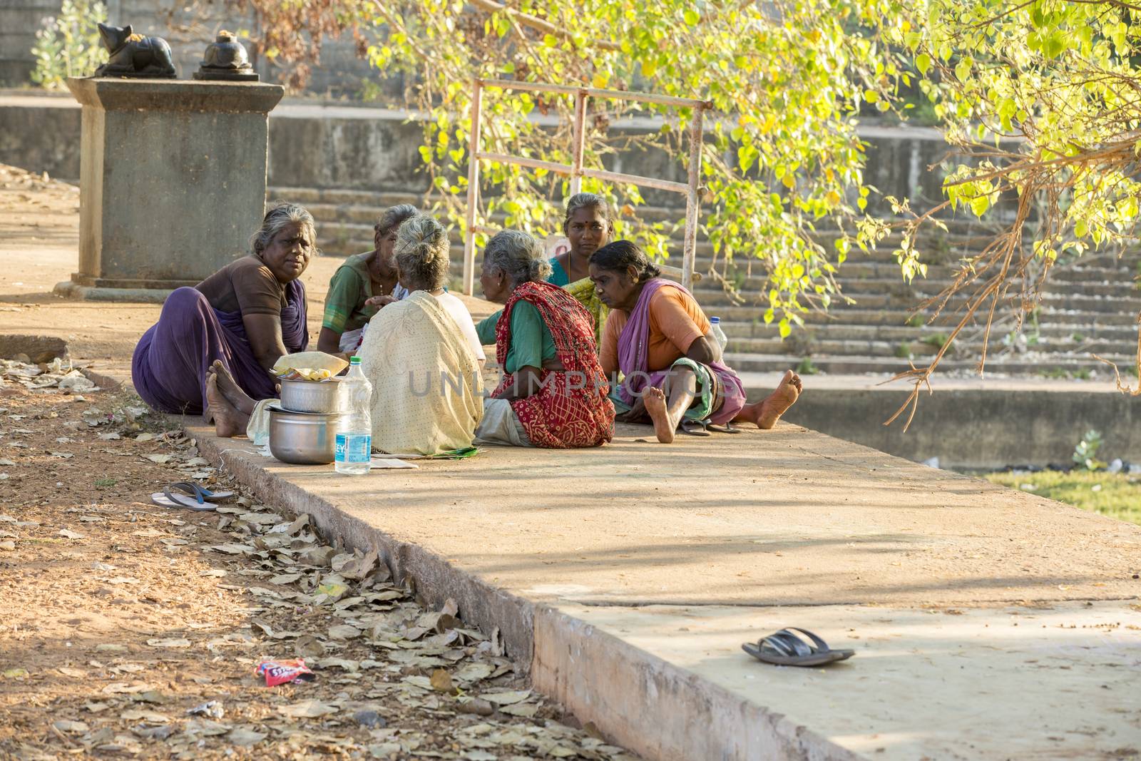 Documentary editorial image. Pondicherry, Tamil Nadu, India - April 24 2014. Very poor families people in the street, talking. Poverty