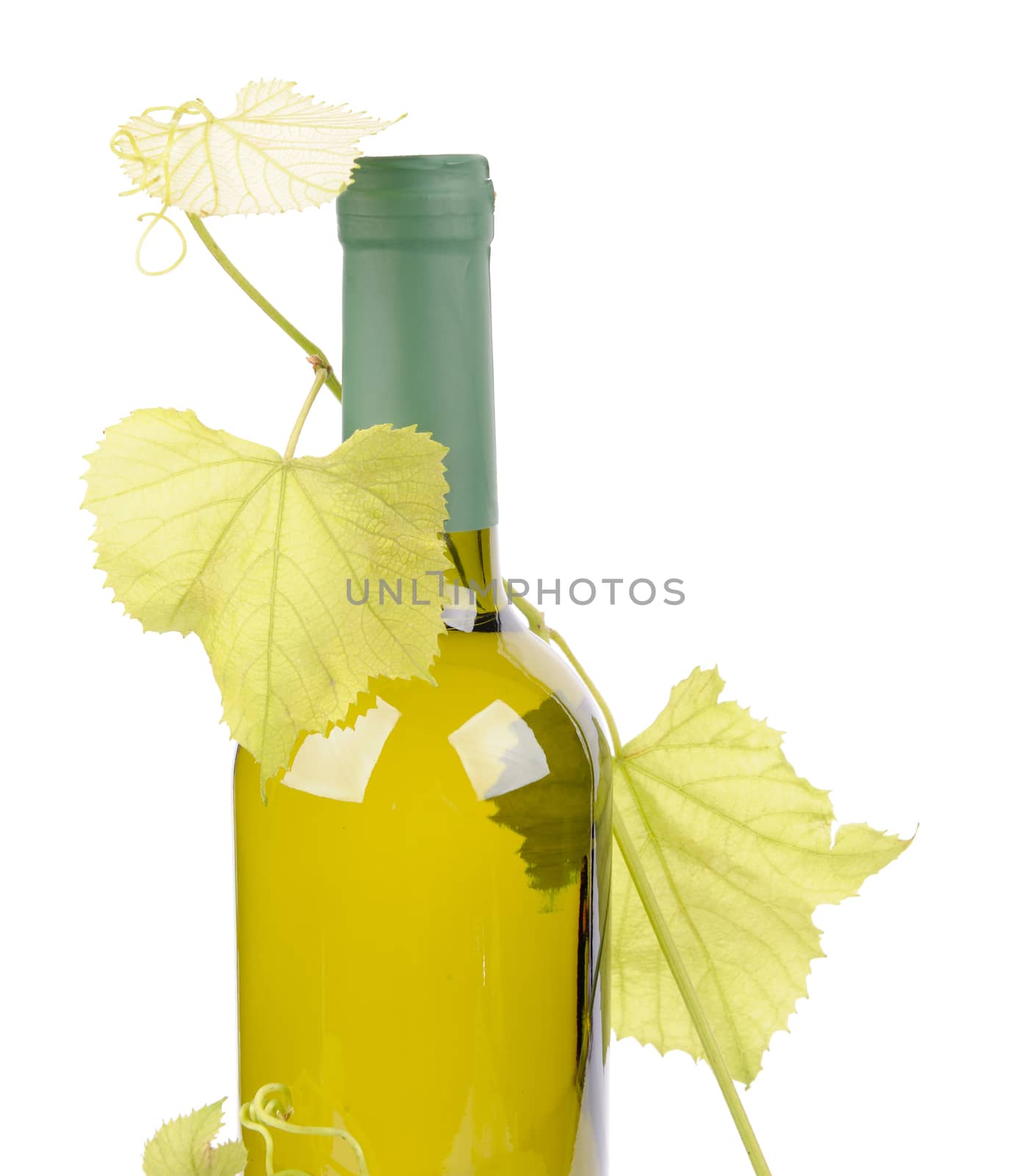 White wine bottle and grapes leaf isolated on white background