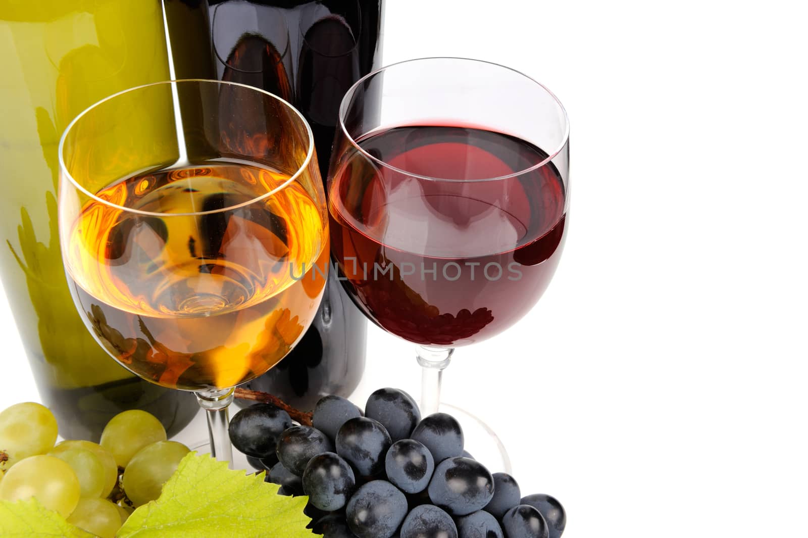 Wine bottle, glass and grapes isolated on white background