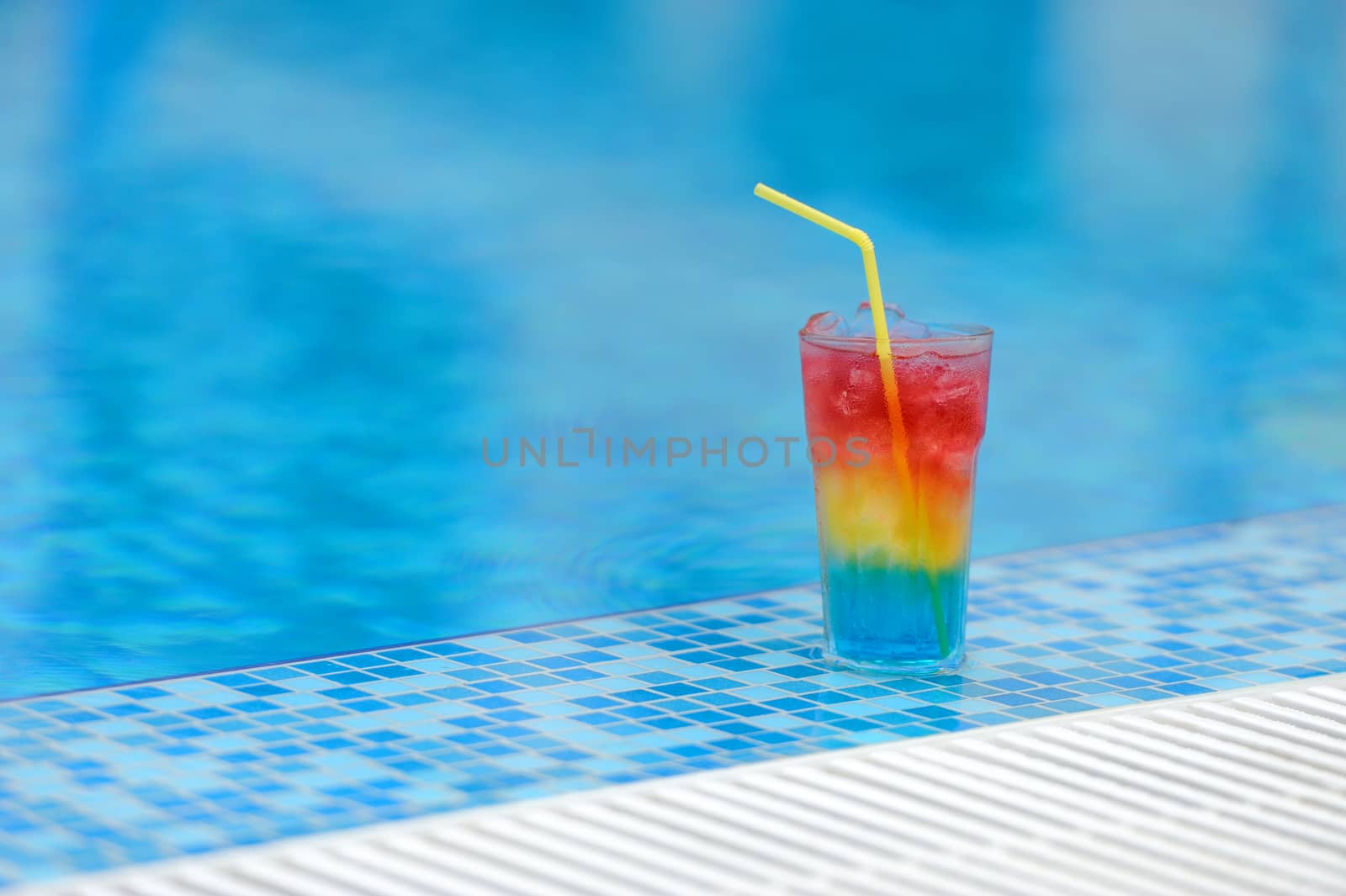 Colourful cocktail on the background of the swimming pool