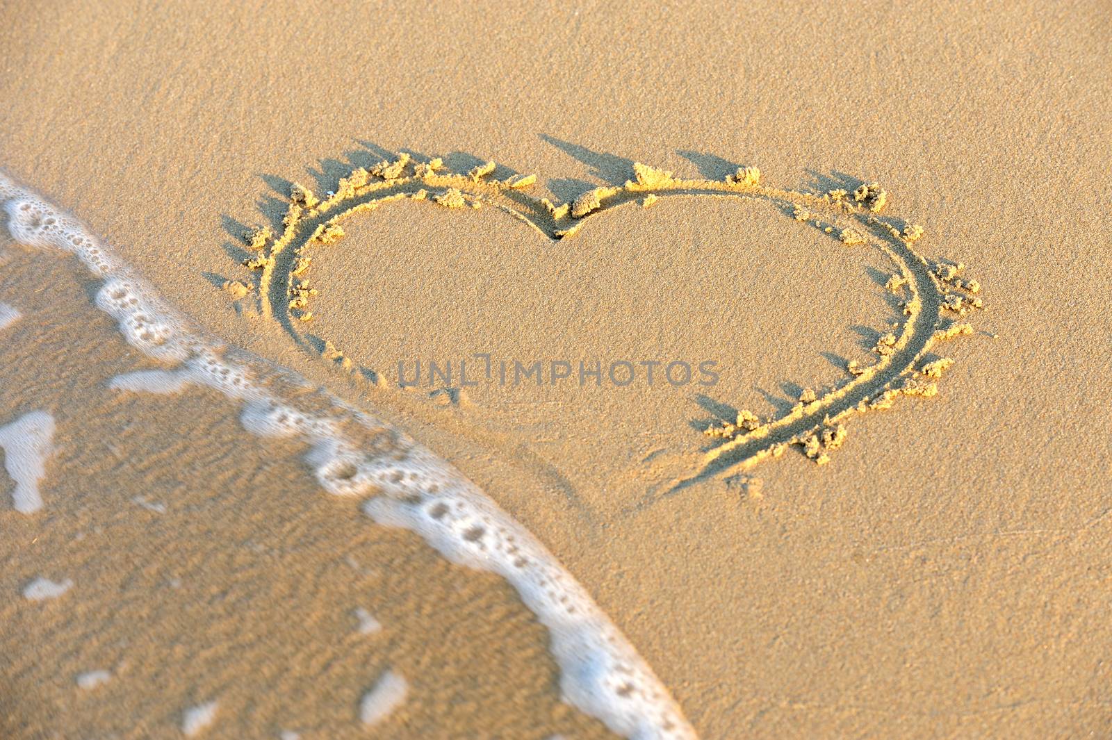 Heart drawn in the sand by byrdyak