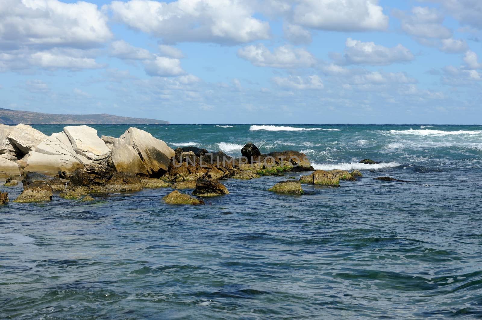 Sea waves rolling on stones