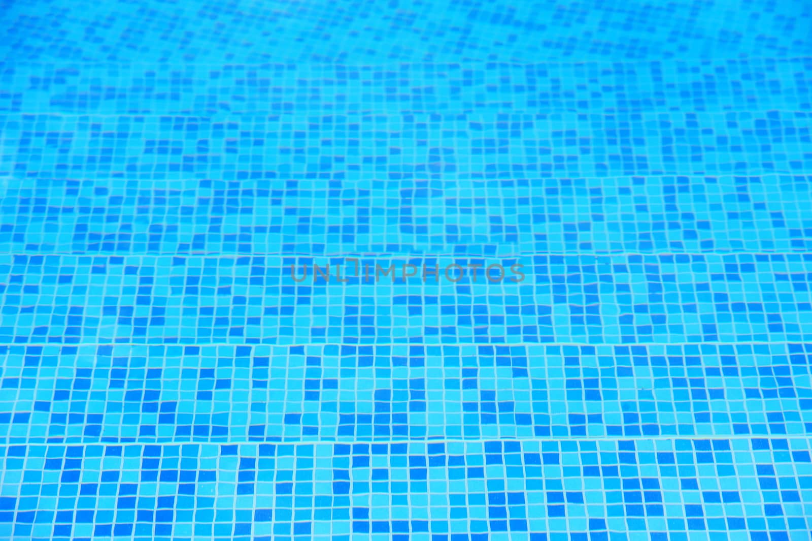 Swimming pool with stair at hotel close up