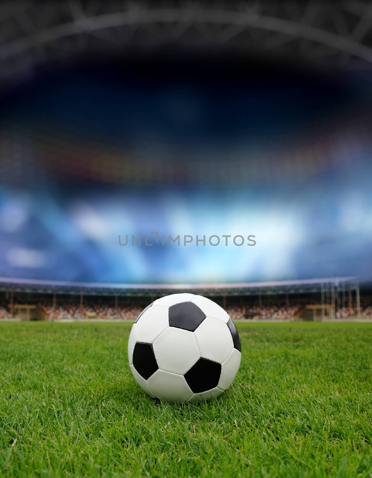 Soccer ball on the field of stadium with light