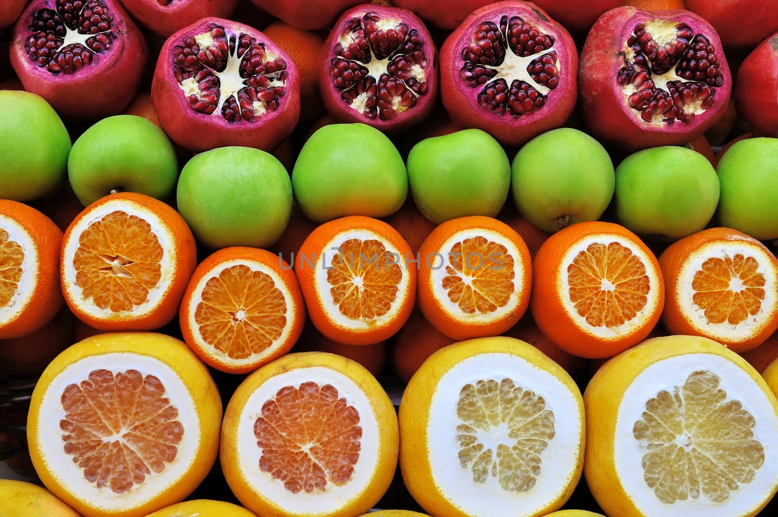 Set of fruits on the market from pomegranates and citrus