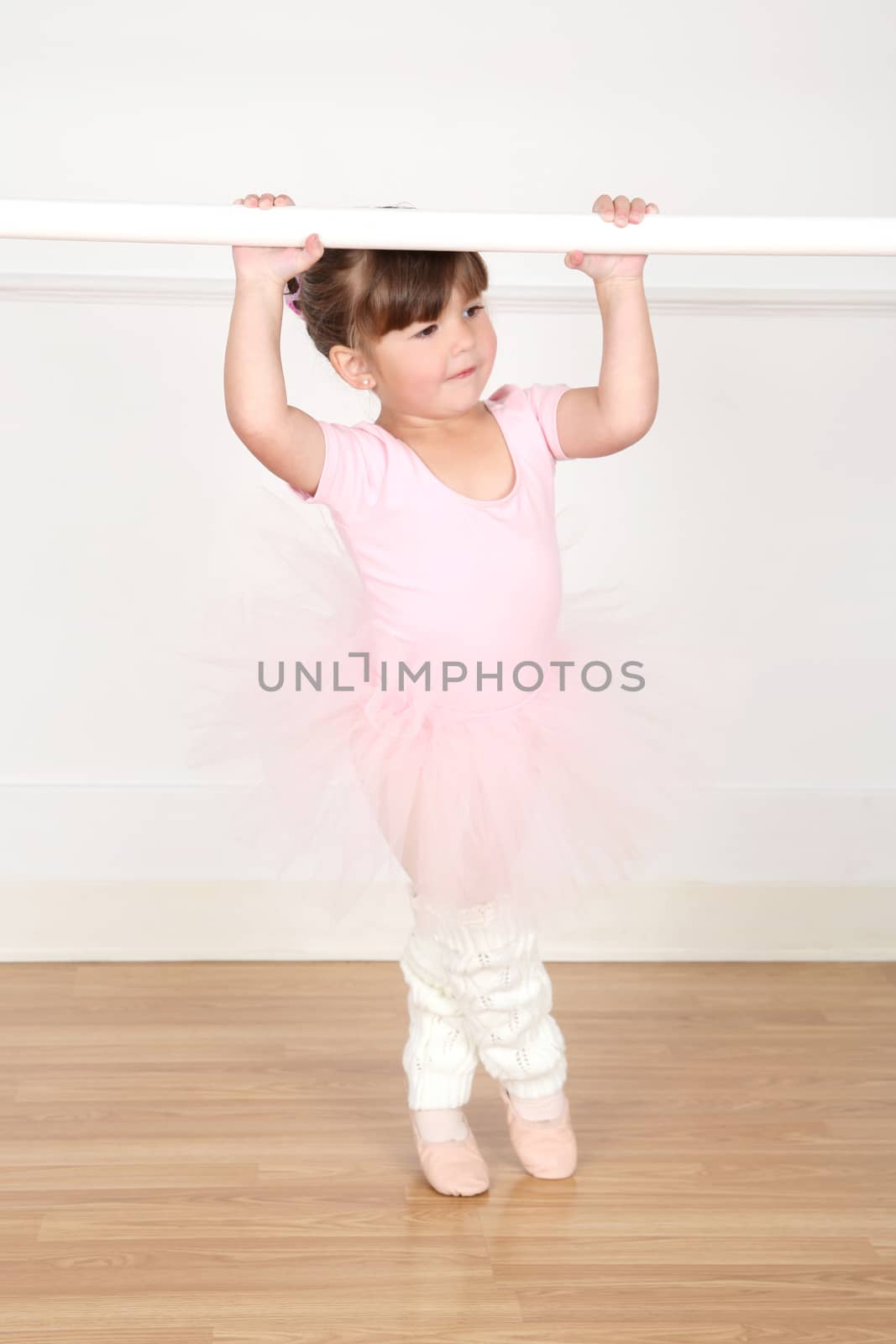 Little ballet girl dancing at the studio