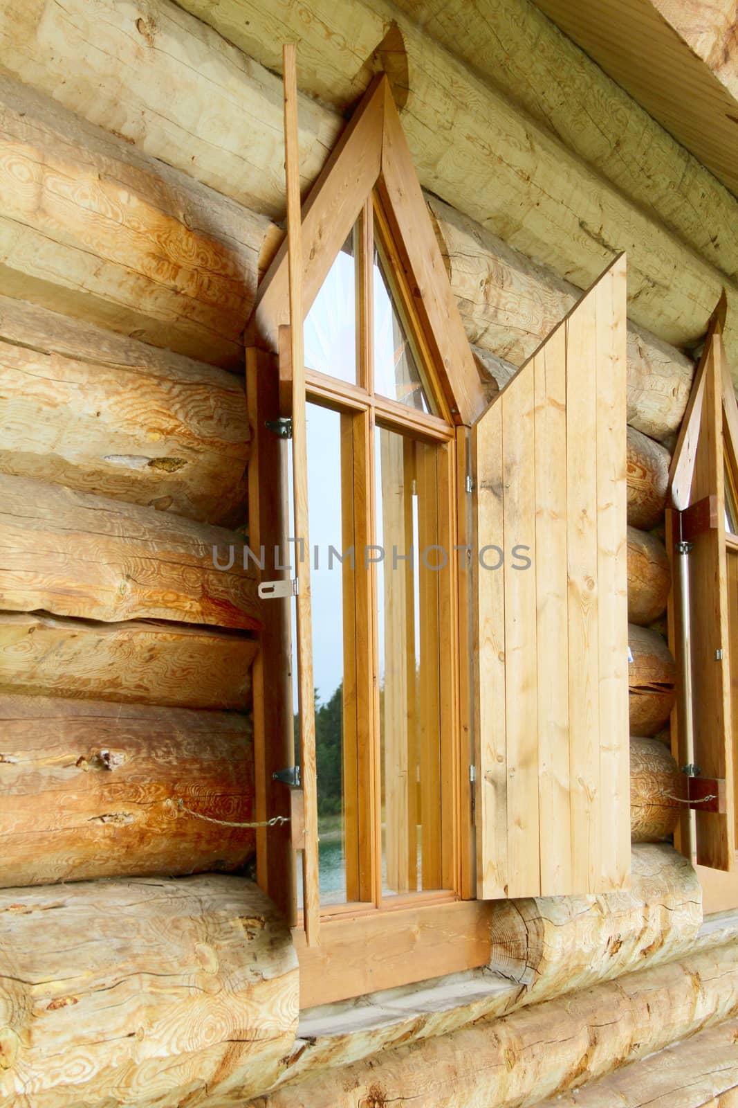 Old log chapel with an open window