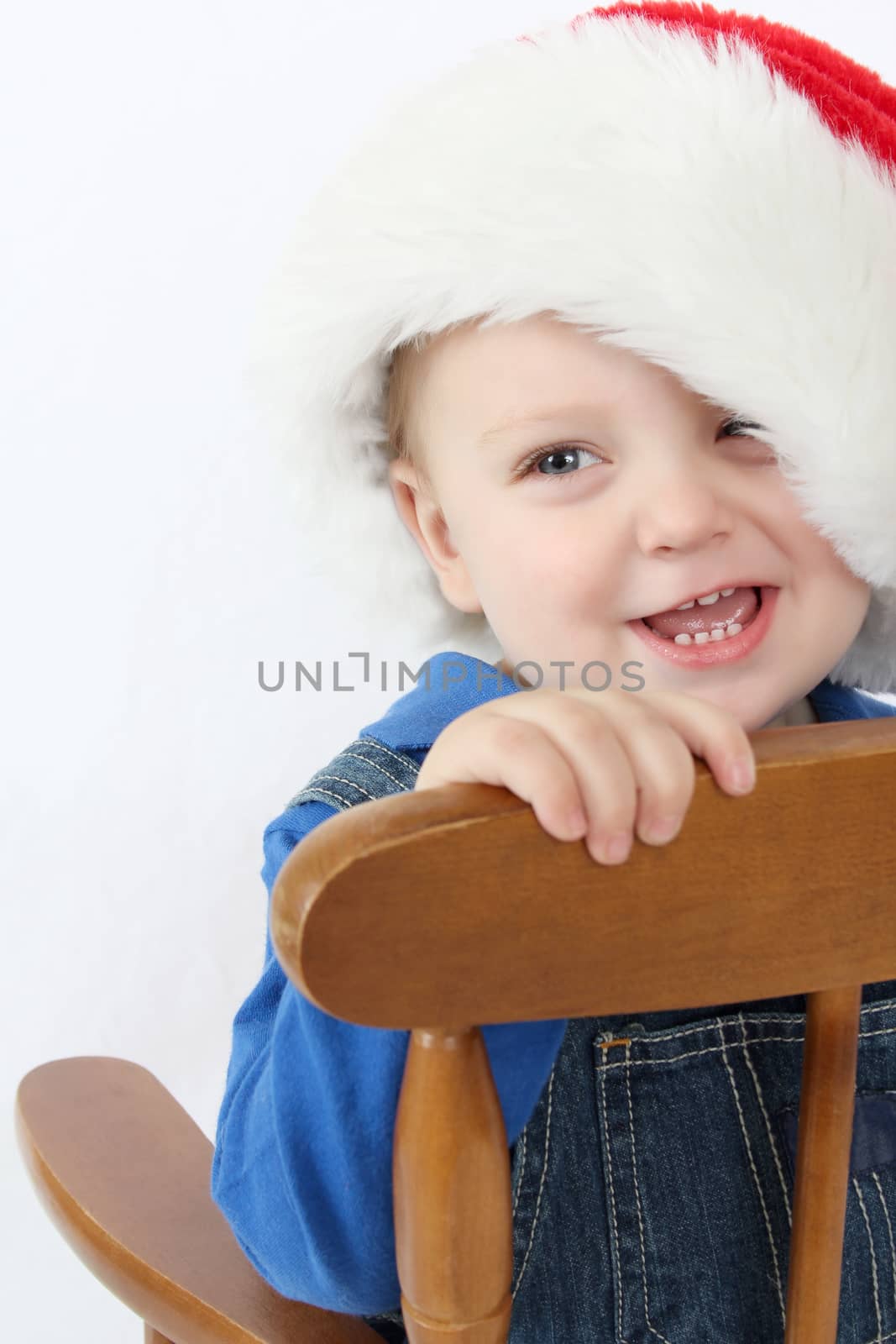Cute baby boy wearing a christmas hat