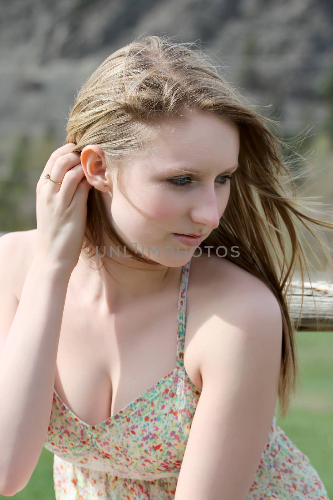 Beautiful blond model outdoors in rural setting natural light