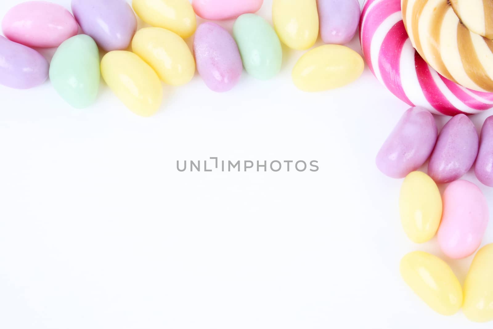 Multi coloured candies on a white background