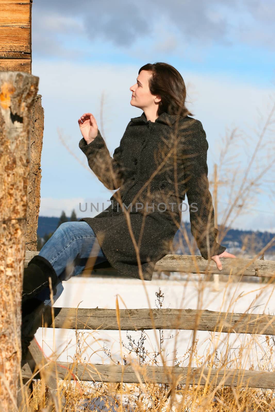 Adult brunette female in a rural setting