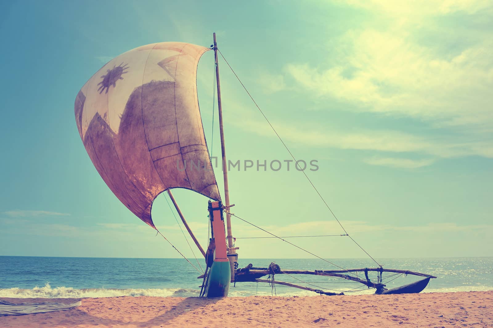 Fishing boats resting on empty beach in Sri Lanka