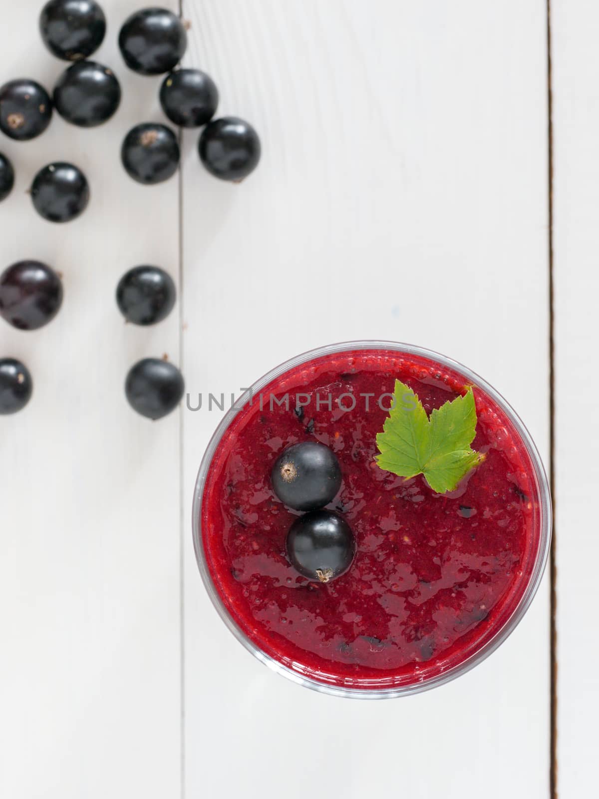 Delicious black currant smoothie with fresh berries by fascinadora