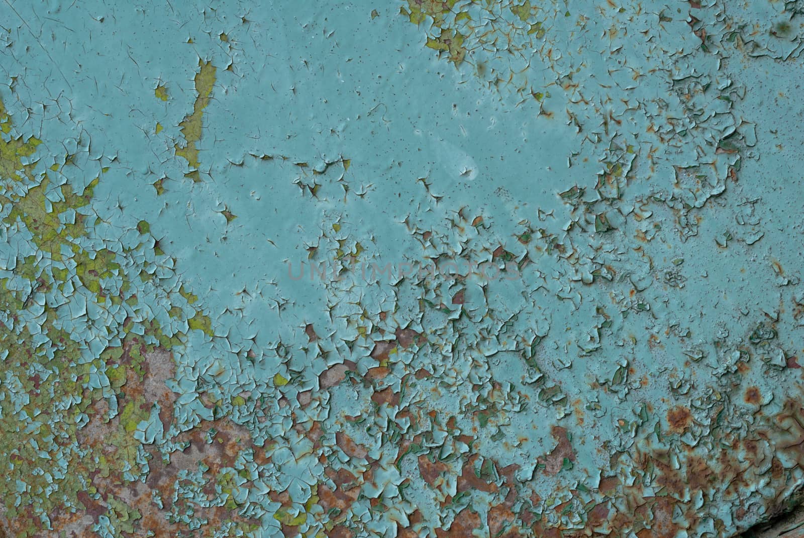 fragment of an iron surface is covered with paint, which has long been under the influence of different climatic conditions